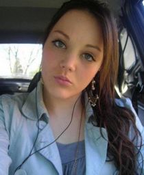 Busty brunette taking a